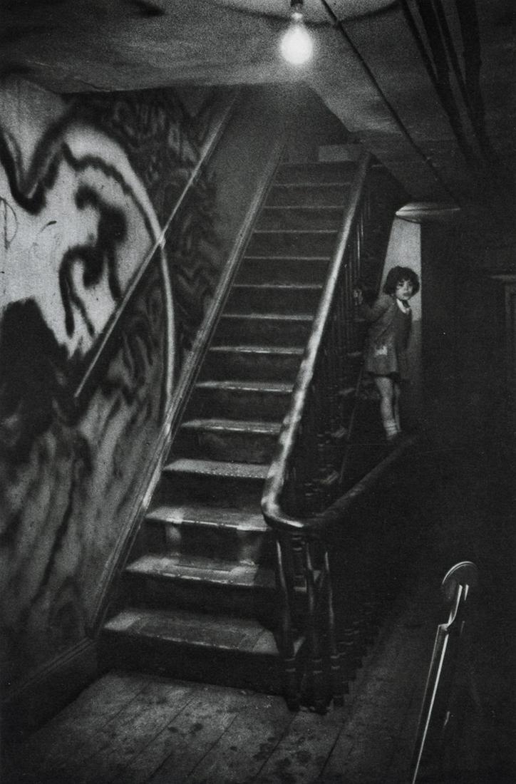 W. EUGENE SMITH - The Loft stairway, Shana, 1957: Artist: W. Eugene Smith Title: The Loft stairway with Smith's daughter, Shana, 1957 Medium: Photo Litho, 1964, USA Dimensions: 4.9x7.4" Description: Heat Wax Mounted on 8.5x11" Conservation Board Arti