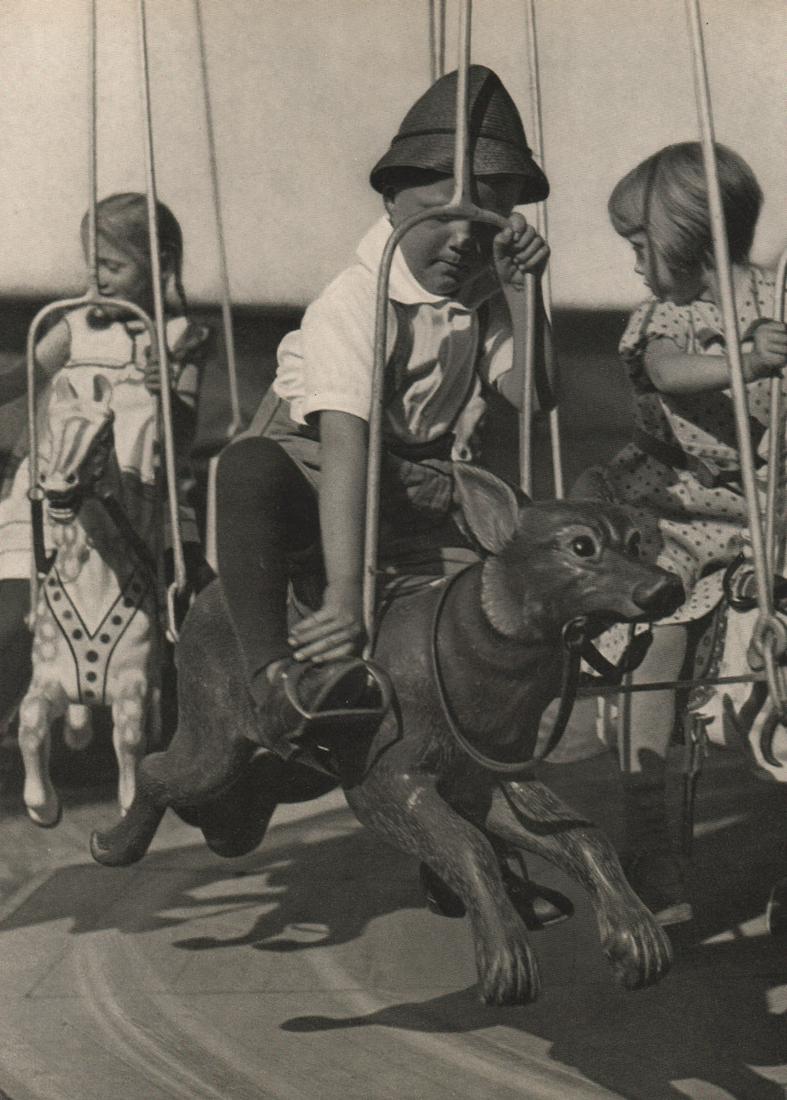 HANS HEINIG - Carousel: Artist:HANS HEINIG Print Title: Carousel Medium: Photoengraving Printed 1935 in Germany Image size (inches) approx. 8.5 x 6” Reserve: $25.00 Shipping: Domestic: Flat rate of $15.00 to anywhere withi