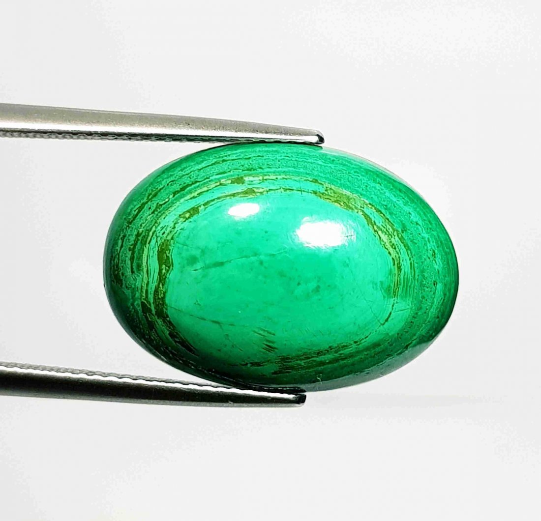 20.20 ct Natural Malachite: No Reserve! Title: 20.20 ct Natural Malachite Color/Clarity:Opaque Carat Weights: 20.2 Size/Dimensions: 21.45 x 15.15 x 6.35 Additional Information:Oval - USA/Egypt Shipping: Domestic: Flat-rate of $