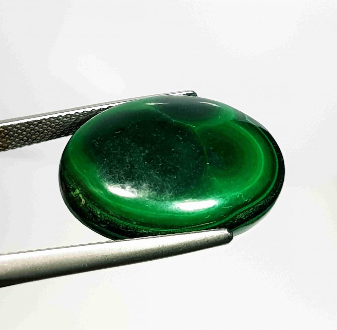 25.46 ct Natural Malachite: No Reserve! Title: 25.46 ct Natural Malachite Color/Clarity:Opaque Carat Weights: 25.46 Size/Dimensions: 22.70 x 16.30 x 5.50 Additional Information:Oval - USA/Egypt Shipping: Domestic: Flat-rate of