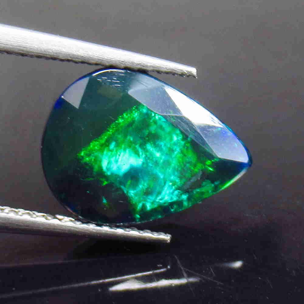 2.15 Ctw Natural Ethiopian Black Fire Opal Pear Cut: No Reserve! Title: 2.15 Ctw Natural Ethiopian Black Fire Opal Pear Cut Stone Clarity: Translucent Gemstone: Black Opal Size/ Dimensions: 2.15 Carat Weights: 12.70 x 9.50 x 4.60 mm Additional Info: Exc