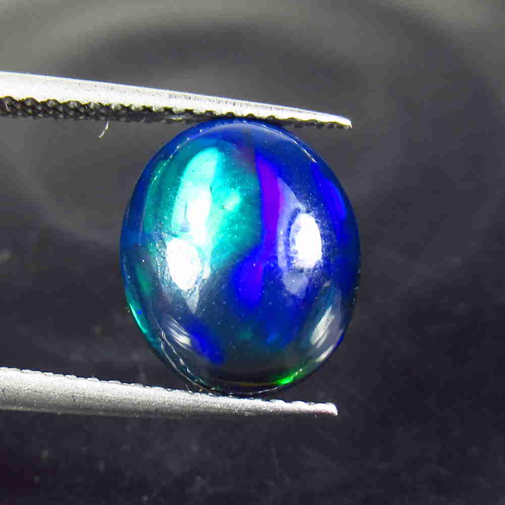 2.71 Ctw Natural Ethiopian Black Fire Opal Oval Cab: No Reserve! Title: 2.71 Ctw Natural Ethiopian Black Fire Opal Oval Cab Stone Clarity: Opaque Gemstone: Black Opal Size/ Dimensions: 2.71 Carat Weights: 11.60 x 9.70 x 5.10 mm Additional Info: Excellen