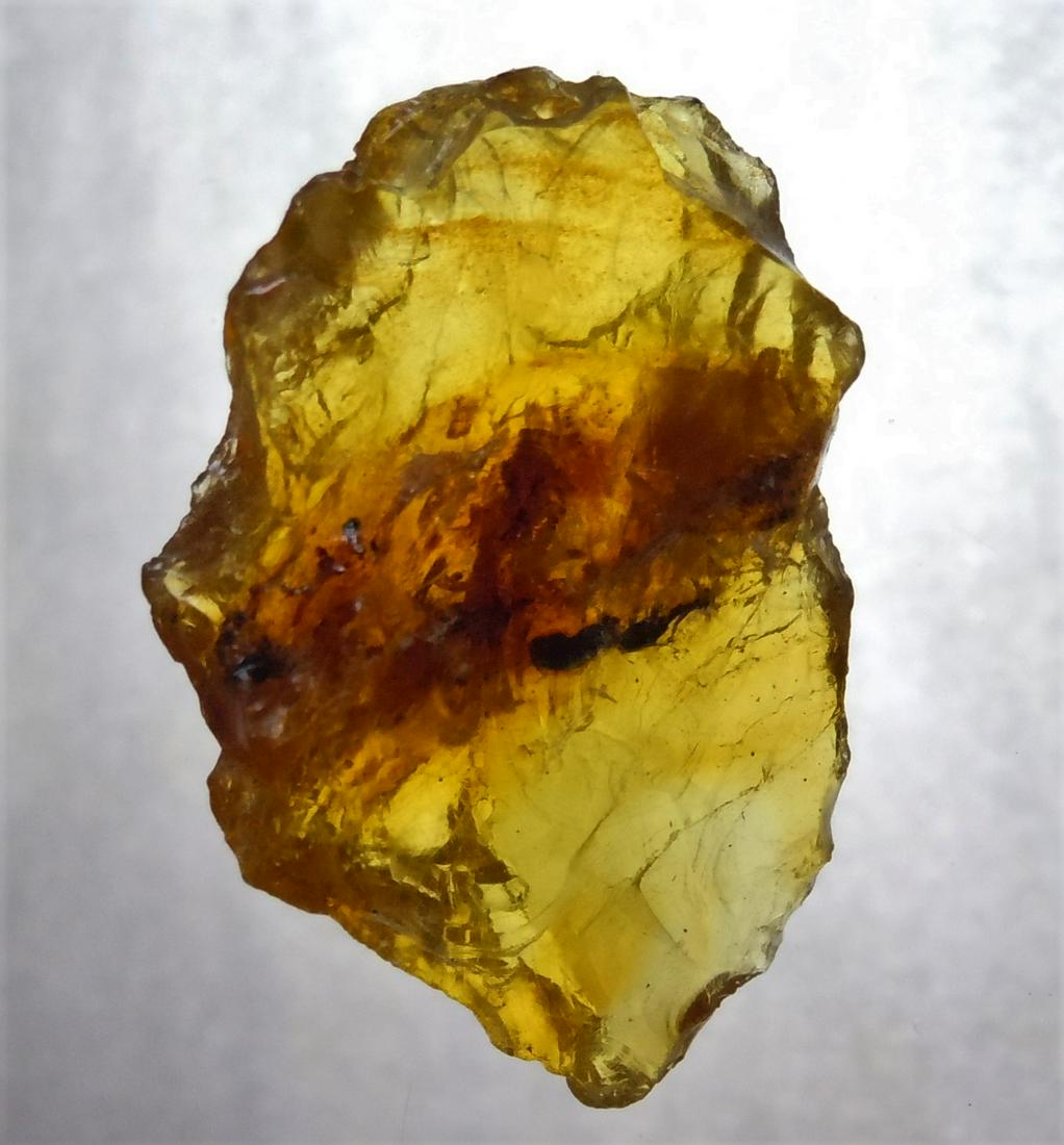 1.70 GRAM 100 MILL YEARS OLD ROUGH BURMITE AMBER: Title: 1.70 GRAM 100 MILL YEARS OLD ROUGH BURMITE AMBER Origin: Hukawang Valley, Kachin State, Myanmar Size: 3x2x0.8 cm / 1.70 gram Description: yellow to orange rough burmite amber with some inclusio