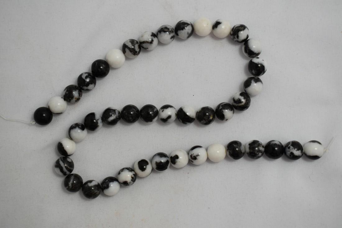 16" Stand of Polished Zebra Jasper Beads: 16" Stand of Polished Zebra Jasper Beads Reserve: $10.00 Shipping: Domestic: Flat-rate of $10.00 to anywhere within the contiguous U.S. International: Foreign shipping rates are determined by destinat
