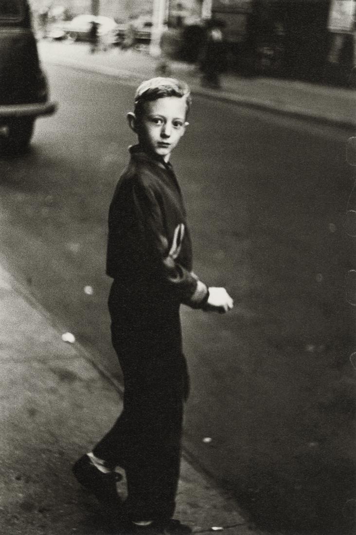 DIANE ARBUS - Boy Stepping Off the Curb, N.Y.C. 1956: Artist: Diane Arbus Title: Boy Stepping Off the Curb, N.Y.C. circa 1956 Medium: Photo Litho, 2003, Germany Dimensions: 5.8x8.7" Description: Heat Wax Mounted on 8.5x11" Conservation Board Artist Bio: 