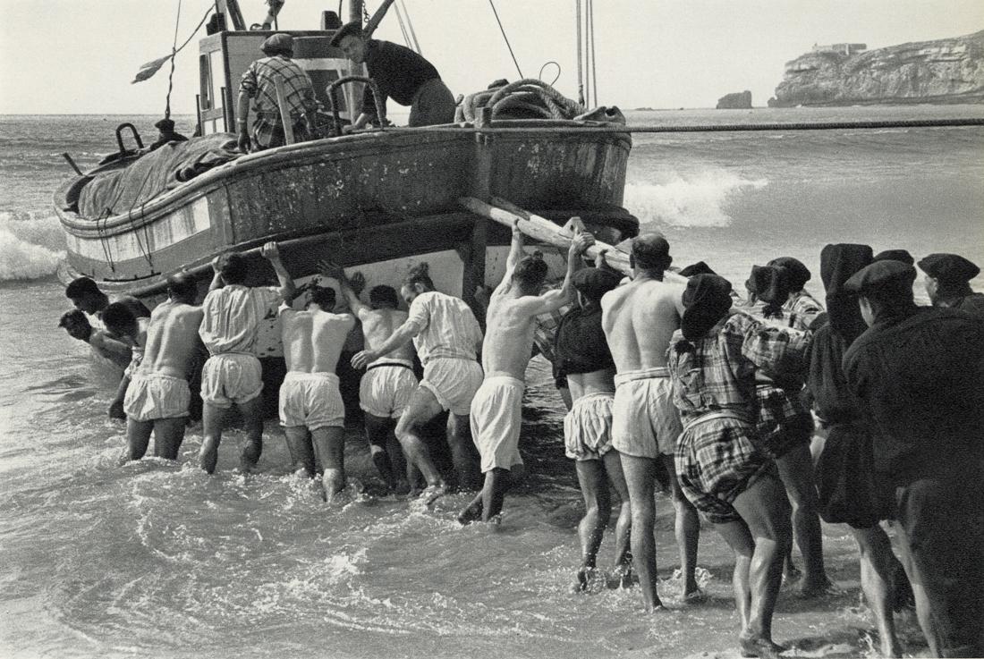EDOUARD BOUBAT - Men and Women of the Sea, 1957: Artist: Edouard Boubat Title: Men and Women of the Sea, Minho And Nazare, Portugal, 1957 Medium: Sheet Fed Gravure, 1973, Switzerland Dimensions: 8.45x5.65" Description: Heat Wax Mounted on 8.5x11" Co
