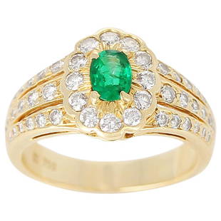 Floral Cluster Emerald and Diamond Ring, 18 Karat: A Floral Emerald and Diamond Ring in 18 Karat Yellow Gold. Emerald Weight: 0.40 carats, Diamond Weight: 0.70 carats. Total Weight: 5.52 grams, Ring Size US 6. Metal 18k Gold,Yellow Gold Stone