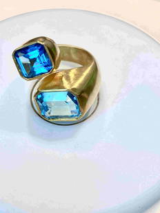 Silver Blue Topaz Ring: Title: Silver Blue Topaz Ring Additional Information: Two top quality Blue Topaz Emerald cuts 13.96 gm , Designer Piece, ANCO Date/Period: 2018 Materials: Silver Dimensions: Silver Ring w. Rodium