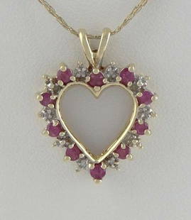 LADIES 10K YELLOW GOLD 1/4ct RUBY DIAMOND HEART JULY: LADIES 10K YELLOW GOLD 1/4ct RUBY DIAMOND HEART JULY FINE PENDANT CHARM .94" 32581 Ladies 10k Yellow Gold (not plated or filled) 1/4ct Ruby & Diamond Heart Pendant! VERY NICE PENDANT! So much nicer