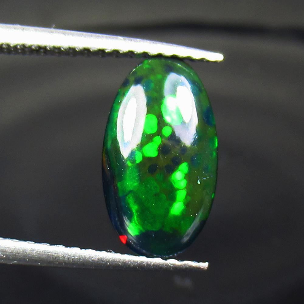 1.68 Ct Natural Ethiopian Black Fire Opal Oval Cut: No Reserve! Title: 1.68 Ct Natural Ethiopian Black Fire Opal Oval Cut Color/Clarity: Translucent Gemstone: Natural Black Opal Carat Weight: 1.68 Size/Dimensions: 11.90 x 6.70 x 4.70 mm Additional Info