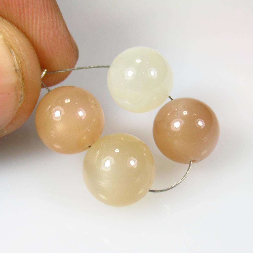 25.07 Ct Natural 4 Drilled Moonstone Ball Beads: No Reserve! Title: 25.07 Ct Natural 4 Drilled Moonstone Ball Beads Color/Clarity: Semi-Transparent Gemstone: Natural Moonstone Beads Carat Weight: 25.07 Size/Dimensions: 9.60 to 9.80 mm / 4 PC's Addit