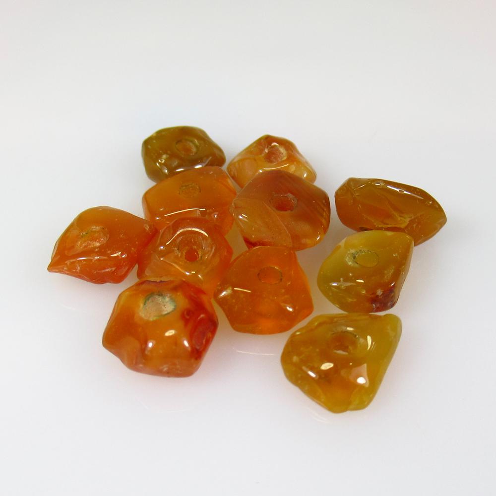 19.85 Ct Natural 11 Carnelian Drilled Unshaped Beads: No Reserve! Title: 19.85 Ct Natural 11 Carnelian Drilled Unshaped Beads Color/Clarity: Transparent Gemstone: Natural Carnelian Beads Carat Weight: 19.85 Size/Dimensions: 7.5x7.0 to 10.0x8.0 mm / 11 PC