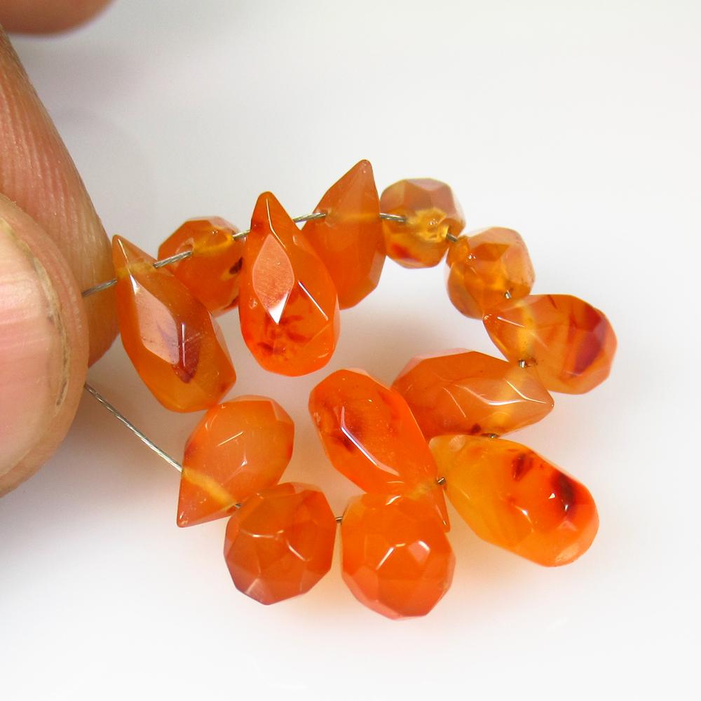 21.46 Ct Natural 13 Drilled Carnelian Pear Drop Beads: No Reserve! Title: 21.46 Ct Natural 13 Drilled Carnelian Pear Drop Beads Color/Clarity: Semi-Transparent Gemstone: Natural Carnelian Beads Carat Weight: 21.46 Size/Dimensions: 9.7x5.3 - 10.7x5.2 mm / 