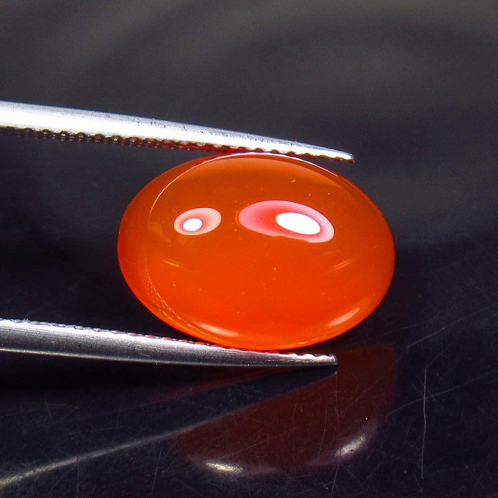 6.00 Ct Natural Carnelian Oval Cabochon: No Reserve! Title: 6.00 Ct Natural Carnelian Oval Cabochon Color/Clarity: Semi-Transparent Gemstone: Natural Carnelian Carat Weight: 6 Size/Dimensions: 14.20 x 10.70 x 5.70 mm Additional Information: 