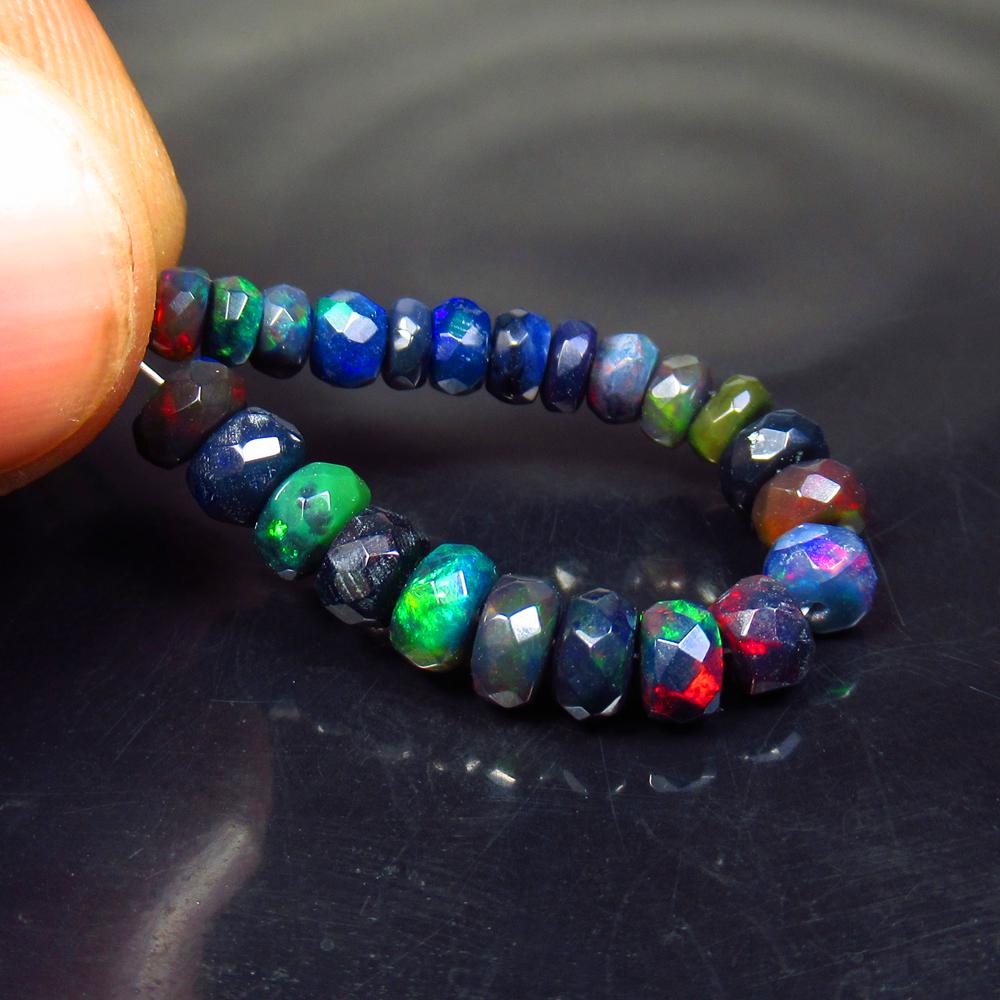 6.38 Ct Natural 28 Drilled Faceted Black Opal Beads: No Reserve! Title: 6.38 Ct Natural 28 Drilled Faceted Black Opal Beads Color/Clarity: Translucent Gemstone: Natural Faceted Black Opal Beads Carat Weight: 6.38 Size/Dimensions: 3.90 to 5.20 mm / 28 PC