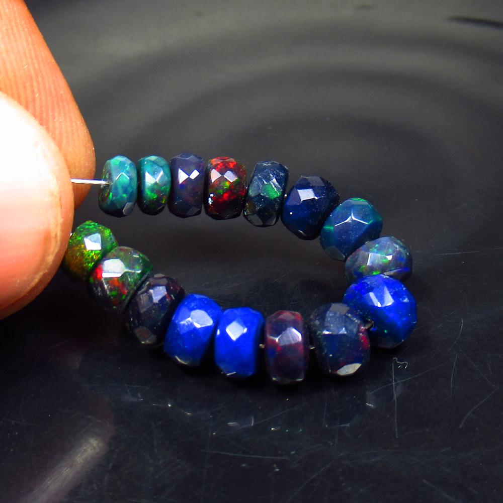 6.74 Ct Natural 16 Drilled Faceted Black Opal Beads: No Reserve! Title: 6.74 Ct Natural 16 Drilled Faceted Black Opal Beads Color/Clarity: Translucent Gemstone: Natural Faceted Black Opal Beads Carat Weight: 6.74 Size/Dimensions: 4.80 to 5.80 mm / 16 PC