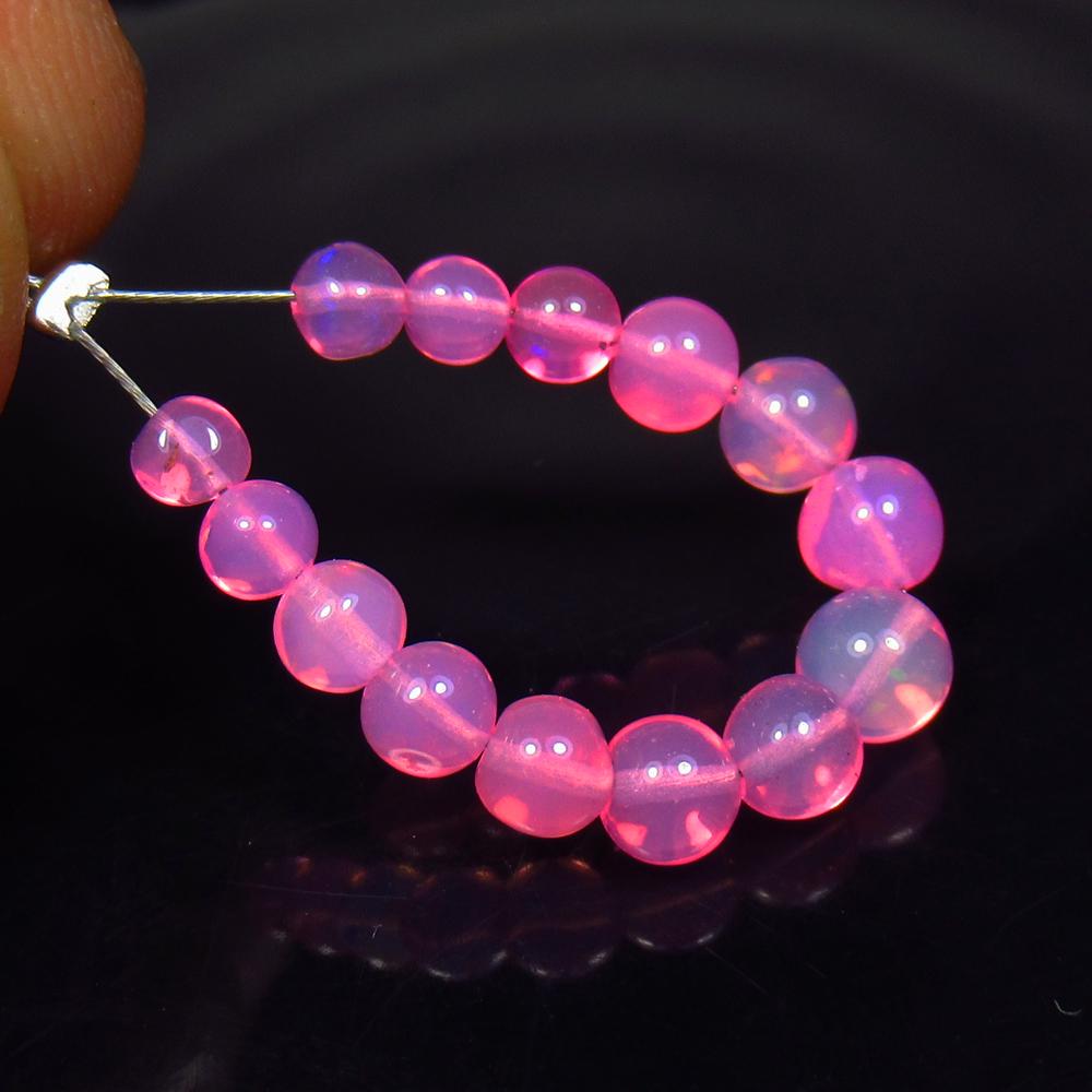 3.80 Ct Natural 14 Drilled Pink Fire Opal Beads: No Reserve! Title: 3.80 Ct Natural 14 Drilled Pink Fire Opal Beads Color/Clarity: Transparent Gemstone: Natural Opal Beads Carat Weight: 3.80 Size/Dimensions: 3.70 to 5.00 mm / 14 PC's Additional Info