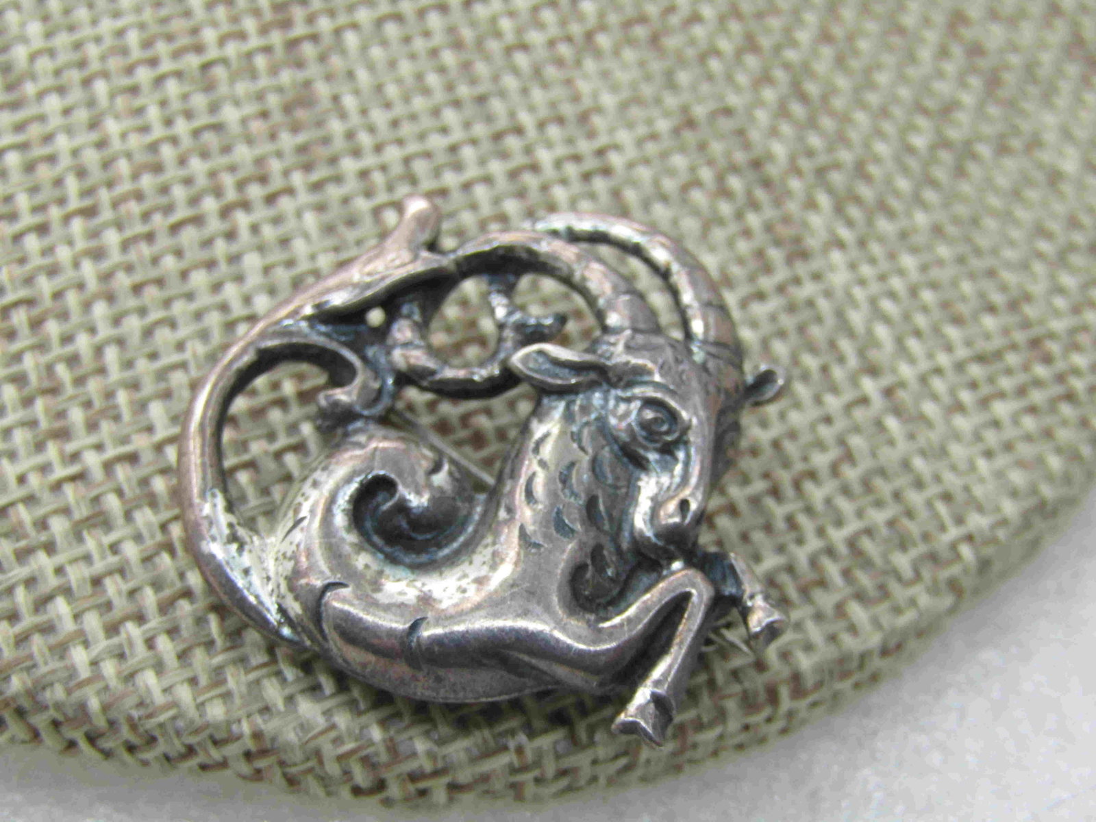 Vintage Sterling Silver Capricorn Goat Brooch, 1", 6.10: Vintage Sterling Silver Capricorn Goat Zodiac Brooch, 1", 6.10 gr. It is slightly over 1" wide and tall. This is the second half of December and first half of January zodiac symbol. Stubborn, hardwork