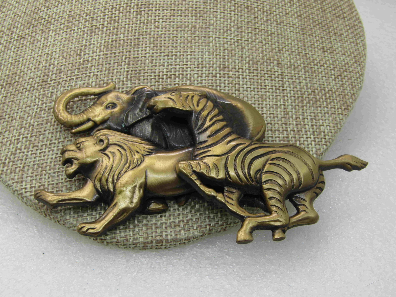 Vintage Safari Animal Stampede Brooch, 4.25" by 2",: Vintage Safari Animal Stampede Brooch, 4.25" by 2", Elephant, Lion, Zebra, pressed brass-like metal with a washed finish to add to the detail. Large and in charge statement brooch. Very good condition