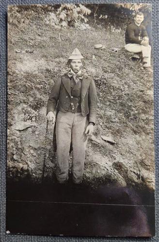 Peculiar Vernacular Photo of Two Men in Odd Costume: Title: Peculiar Vernacular Photo of Two Men in Odd Costume Description: Very Odd Real Photo Postcard of two men. Man in foreground in strange attire with hat & cigarette. Noted on back is "Irish Parod