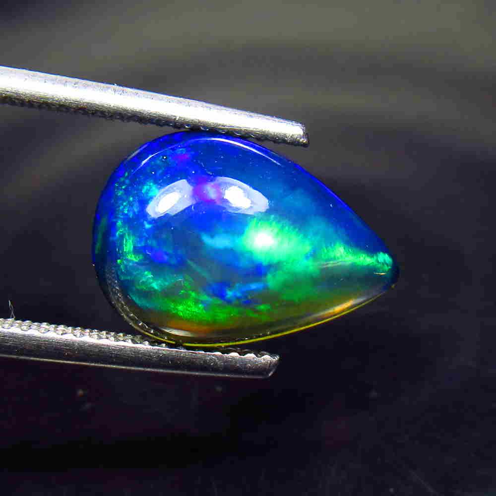 4.06 Ctw Natural Ethiopian Black Fire Opal Pear Cab: Title: 4.06 Ctw Natural Ethiopian Black Fire Opal Pear Cab Stone Clarity: Translucent Gemstones: Black Opal Size/Dimensions: 4.06 Carat Weights: 15.80 x 10.50 x 5.50 mm Additional Information: Excelle
