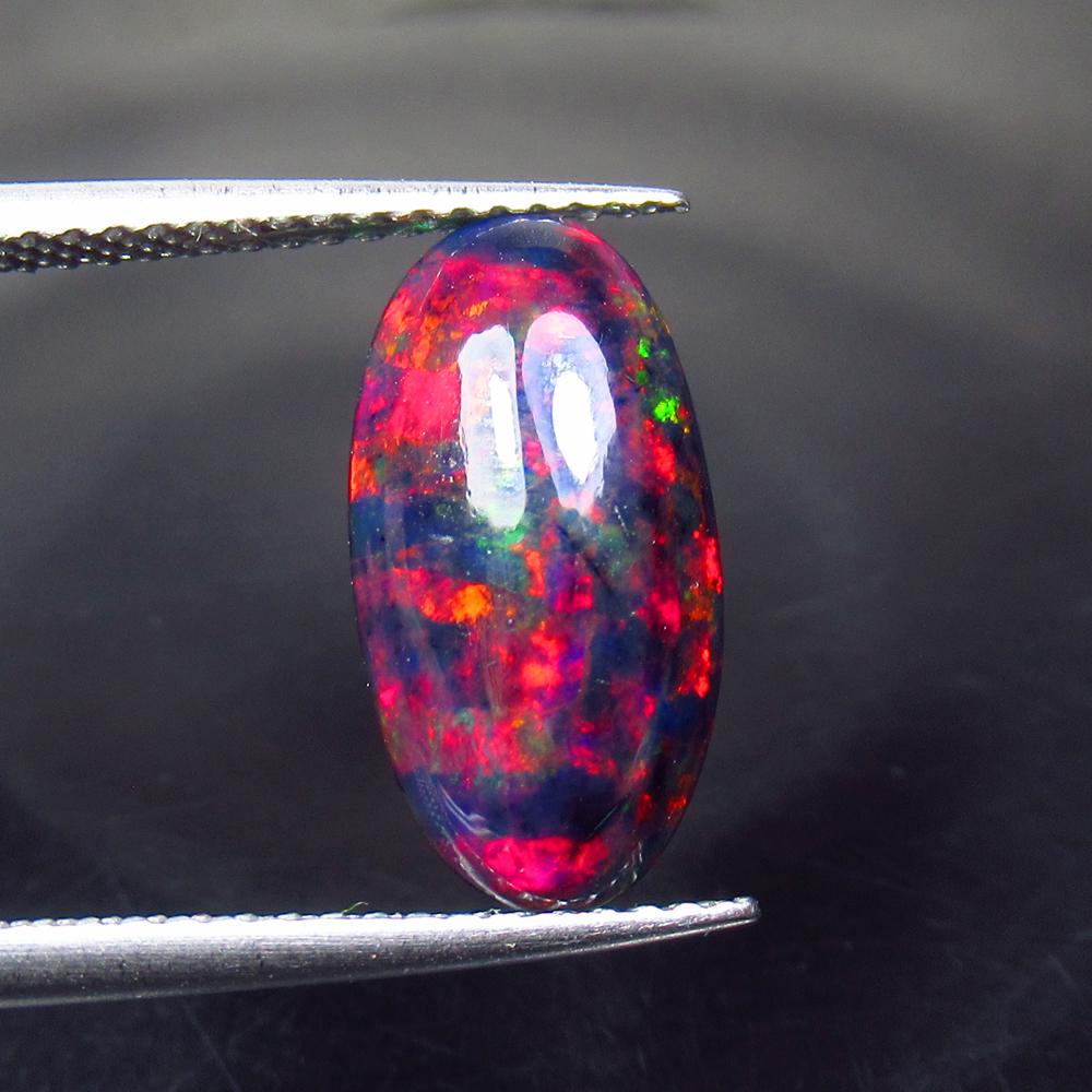 1.76 Ct Natural Ethiopian Black Fire Opal Oval Cab: Title: 1.76 Ct Natural Ethiopian Black Fire Opal Oval Cab Stone Clarity: Translucent Gemstones: Natural Black Opal Carat Weights: 1.76 Size/Dimensions: 14.70 x 7.70 x 3.60 mm Additional Information: E