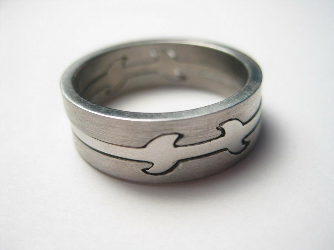 Men's Stainless Sawtooth Puzzle Wedding Ring, Size 10,: Men's Stainless Sawtooth Puzzle Wedding Band/Ring,Biker Ring. Size 10. It is 7.5mm wide and it has a smooth and shiny surface. It is made up of three bands - the outer bands are brushed and the center