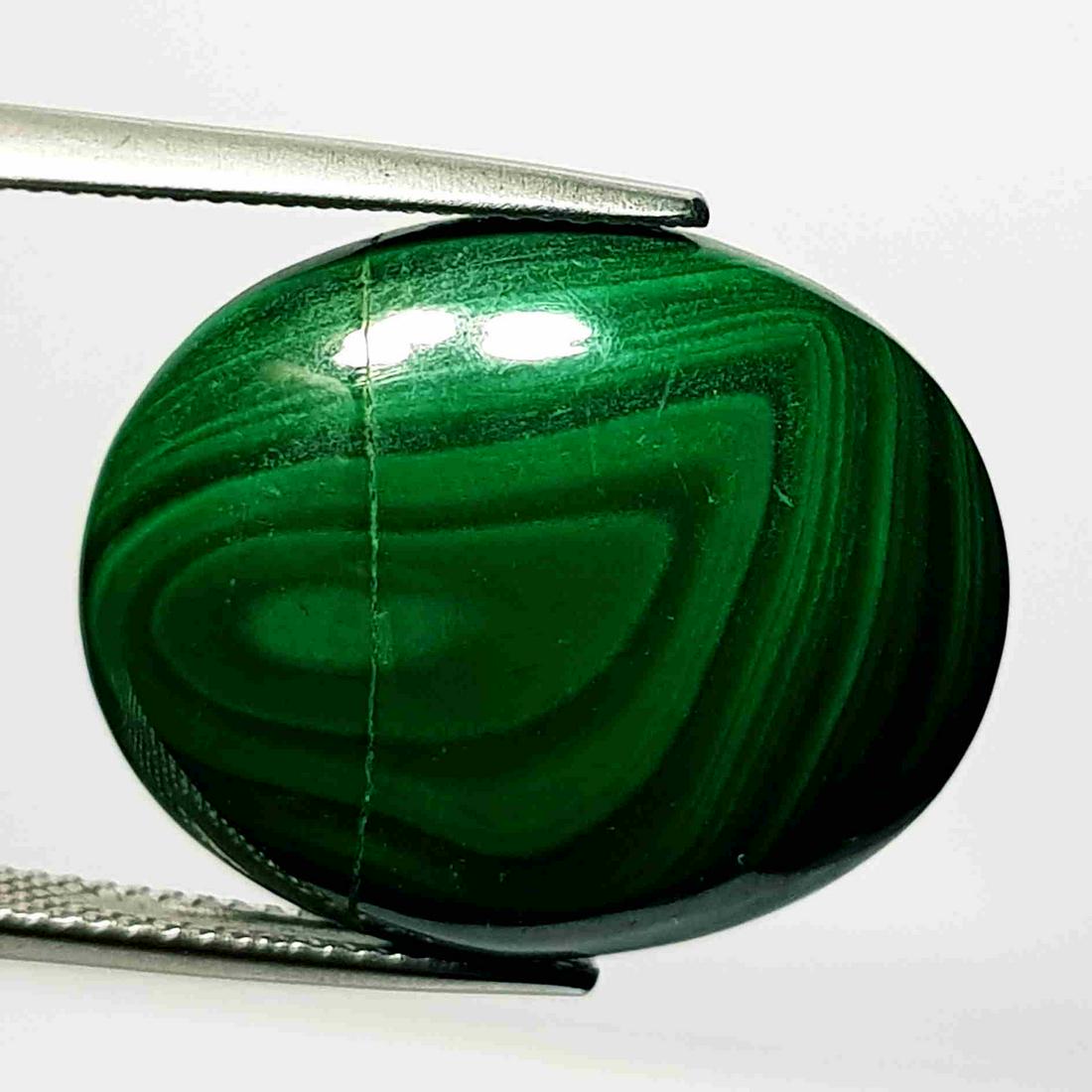 26.97 ct Natural Malachite: No Reserve! Title: 26.97 ct Natural Malachite Color/Clarity: Opaque Gemstones: Loosegemstone Carat Weights: 26.97 Size/Dimensions: 23.45 x 19.20 x 5.50 Additional Information: Oval - USA/Egypt Shippin