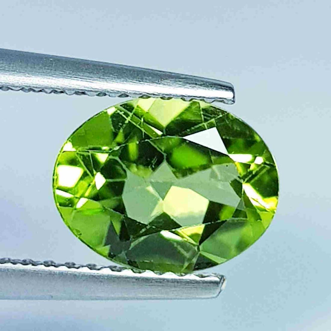 1.76 Ct Natural Peridot Oval Cut: No Reserve! Title: 1.76 Ct Natural Peridot Oval Cut Color/Clarity: IF - VVS Gemstones: Loosegemstone Carat Weights: 1.76 Size/Dimensions: 9.00 x 7.00 x 4.00 Additional Information: Oval / Pakistan Shi