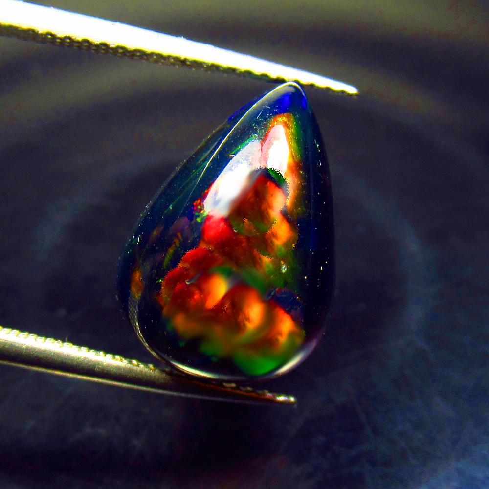6.25 Ctw Natural Ethiopian Black Fire Opal Pear Cab: No Reserve! Title: 6.25 Ctw Natural Ethiopian Black Fire Opal Pear Cab Stone Clarity: Translucent Gemstone: Black Opal Carat Weight: 6.25 Size/Dimensions: 15.70 x 10.70 x 7.80 mm Additional Informatio