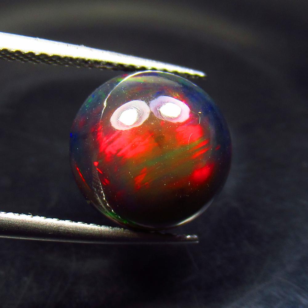 3.86 Ctw Natural Ethiopian Black Fire Opal Round Cab: No Reserve! Title: 3.86 Ctw Natural Ethiopian Black Fire Opal Round Cab Stone Clarity: Translucent Gemstone: Black Opal Carat Weight: 3.86 Size/Dimensions: 11.30 x 11.30 x 6.30 mm Additional Informati