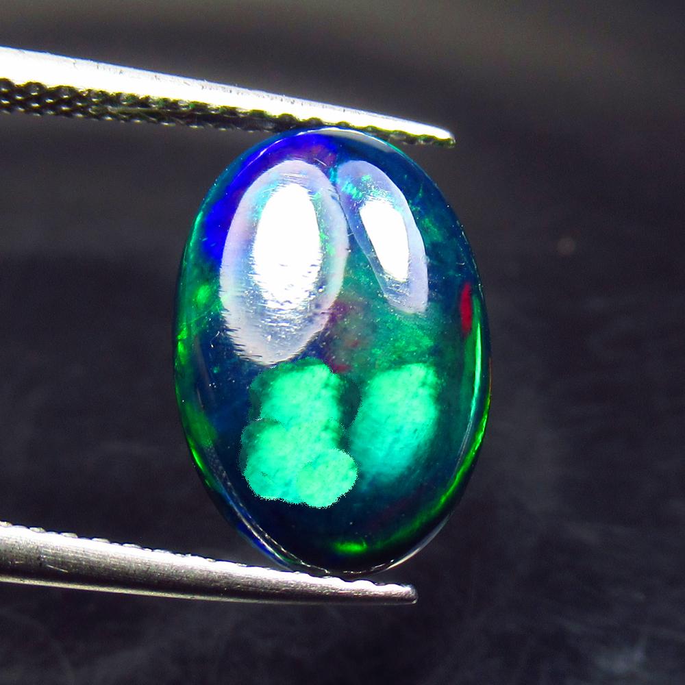 1.94 Ctw Natural Ethiopian Black Fire Opal Oval Cab: No Reserve! Title: 1.94 Ctw Natural Ethiopian Black Fire Opal Oval Cab Stone Clarity: Translucent Gemstone: Black Opal Carat Weight: 1.94 Size/Dimensions: 13.40 x 9.20 x 3.30 mm Additional Information