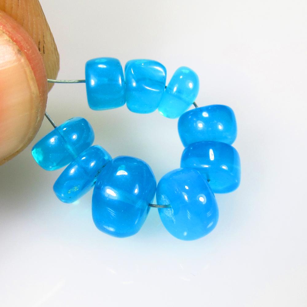 8.15 Ctw Natural 9 Drilled Neon Blue Fire Opal Beads: No Reserve! Title: 8.15 Ctw Natural 9 Drilled Neon Blue Fire Opal Beads Stone Clarity: Transparent Gemstone: Opal Beads Carat Weight: 8.15 Size/Dimensions: 5.80 to 8.00 mm / 9 PC's Additional Informat