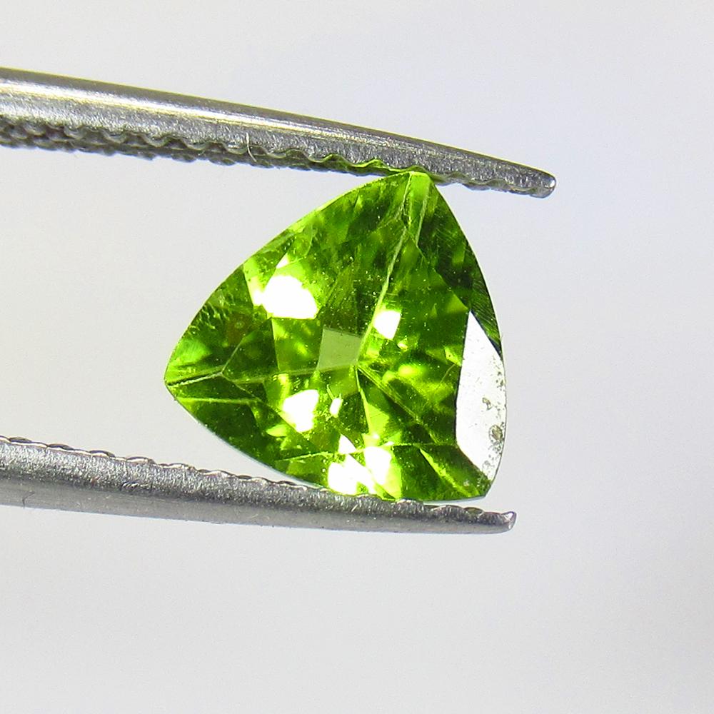 1.23 Ctw Natural Pakistan Peridot Trillion Cut: No Reserve! Title: 1.23 Ctw Natural Pakistan Peridot Trillion Cut Stone Clarity: VVS Gemstone: Peridot Carat Weight: 1.23 Size/Dimensions: 7.00 x 7.00 x 4.20 mm Additional Information: Top Class Luste