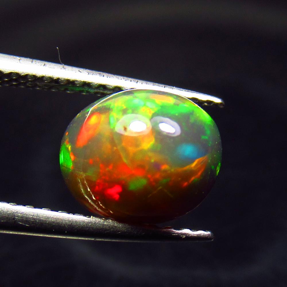 1.88 Ctw Natural Ethiopian Black Fire Opal Oval Cab: No Reserve! Title: 1.88 Ctw Natural Ethiopian Black Fire Opal Oval Cab Stone Clarity: Translucent Gemstone: Black Opal Carat Weight: 1.88 Size/Dimensions: 9.00 x 7.20 x 5.50 mm Additional Information:
