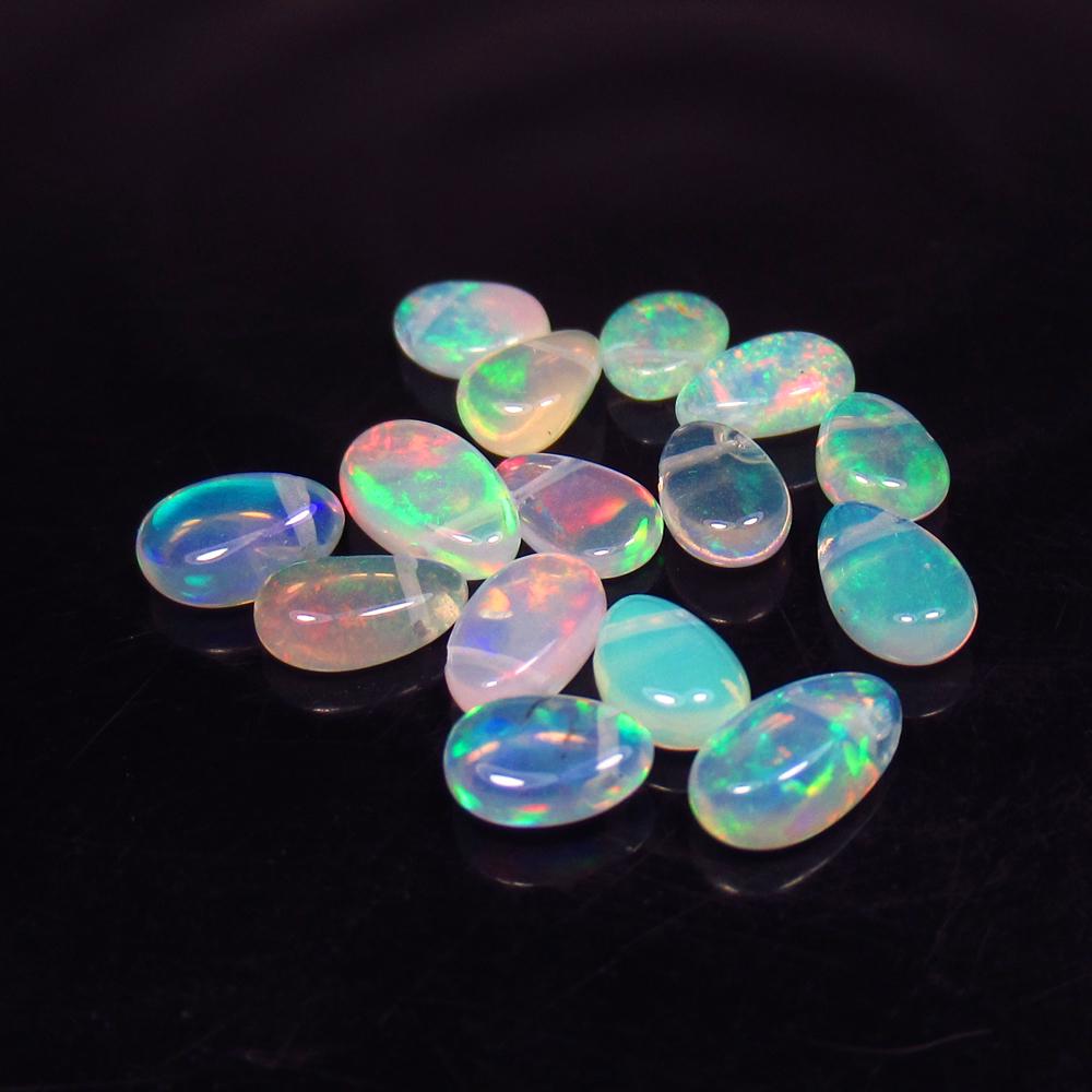 5.40 Ctw Natural 16 Drilled Pear Multi-Color Fire Opal: No Reserve! Title: 5.40 Ctw Natural 16 Drilled Pear Multi-Color Fire Opal Beads Stone Clarity: Transparent Gemstone: Pear Opal Beads Carat Weight: 5.4 Size/Dimensions: 6.3x4.5 to 7.8x4.8 mm / 16 PC's 