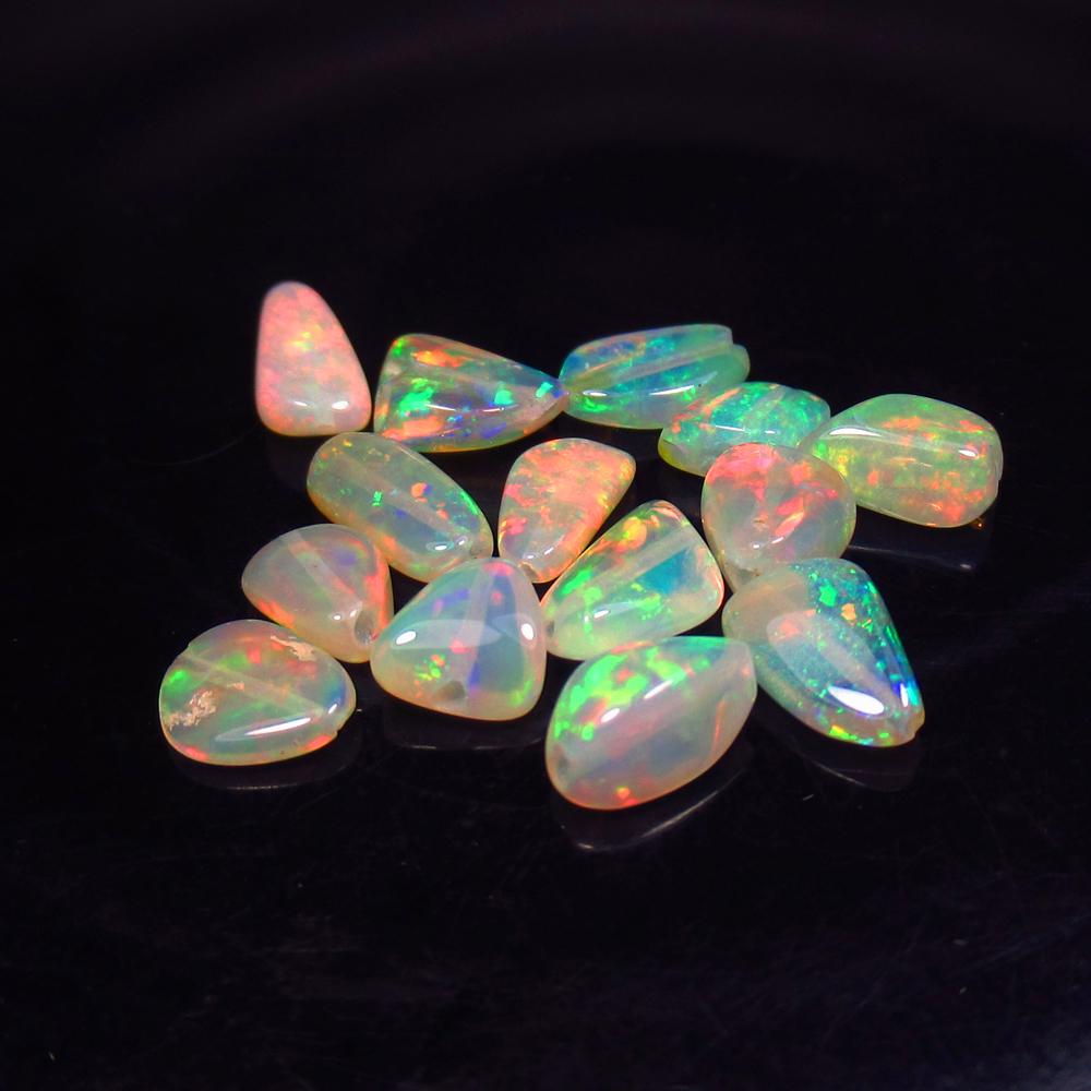 5.40 Ctw Natural 14 Drilled Fire Opal Beads: No Reserve! Title: 5.40 Ctw Natural 14 Drilled Fire Opal Beads Stone Clarity: Transparent Gemstone: Fire Opal Beads Carat Weight: 5.40 Size/Dimensions: 6.0x4.9 to 8.0x5.0 mm / 14 PC's Additional Infor