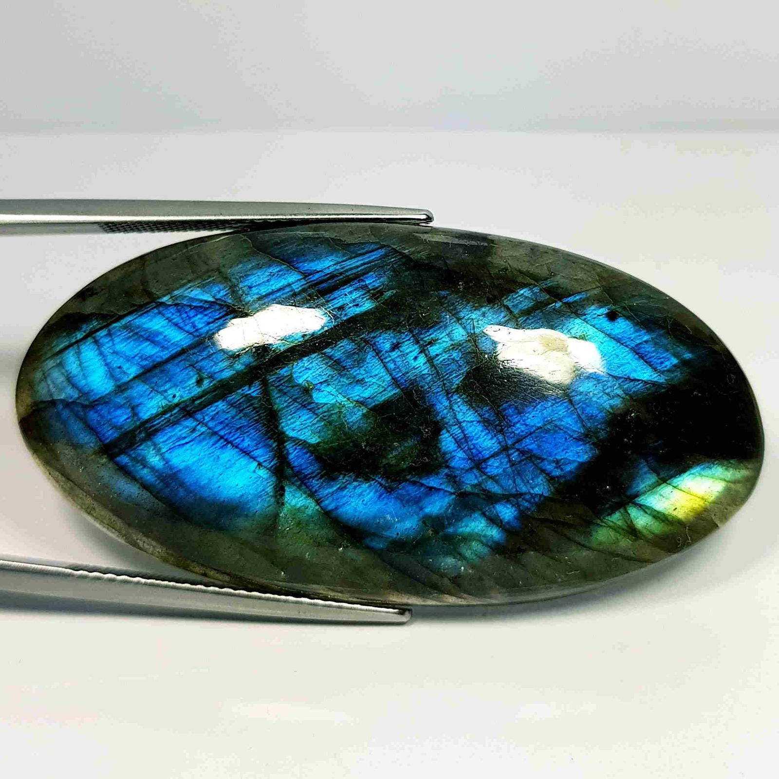76.25 Ct Natural Labradorite: No Reserve! Title: 76.25 Ct Natural Labradorite Color/Clarity: Opaque Gemstones: LooseGemstone Carat Weights: 76.25 Size/Dimensions: 48.40 x 24.50 x 7.70 Additional Information: Oval - USA Shipping: