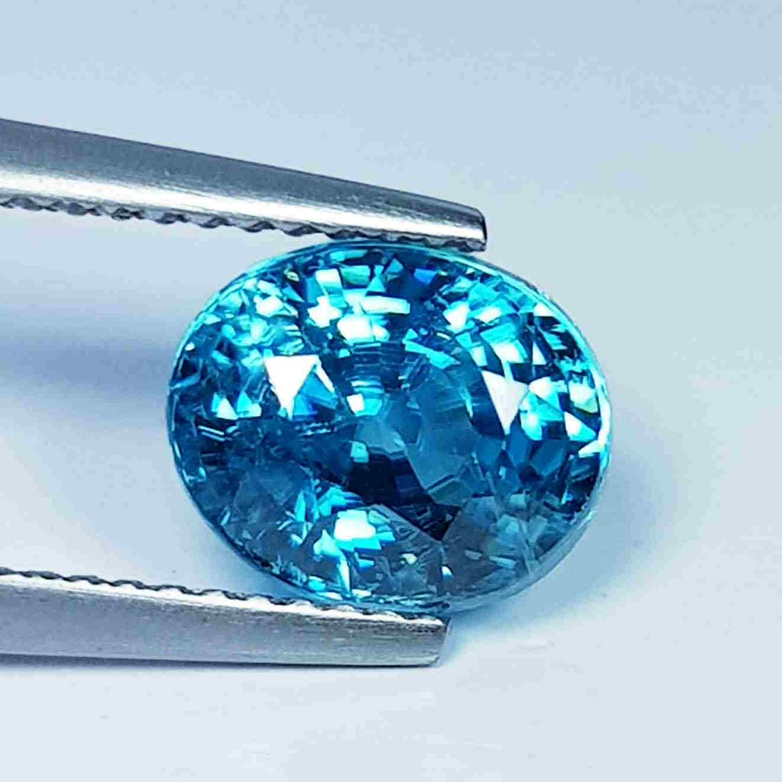 4.01 Ct " IGI Certified " Natural Blue Zircon: No Reserve! Title: 4.01 Ct " IGI Certified " Natural Blue Zircon Color/Clarity: IF - VVS Gemstones: Loosegemstone Carat Weights: 4.01 Size/Dimensions: 8.75 x 7.19 x 6.09 Additional Information: Oval -