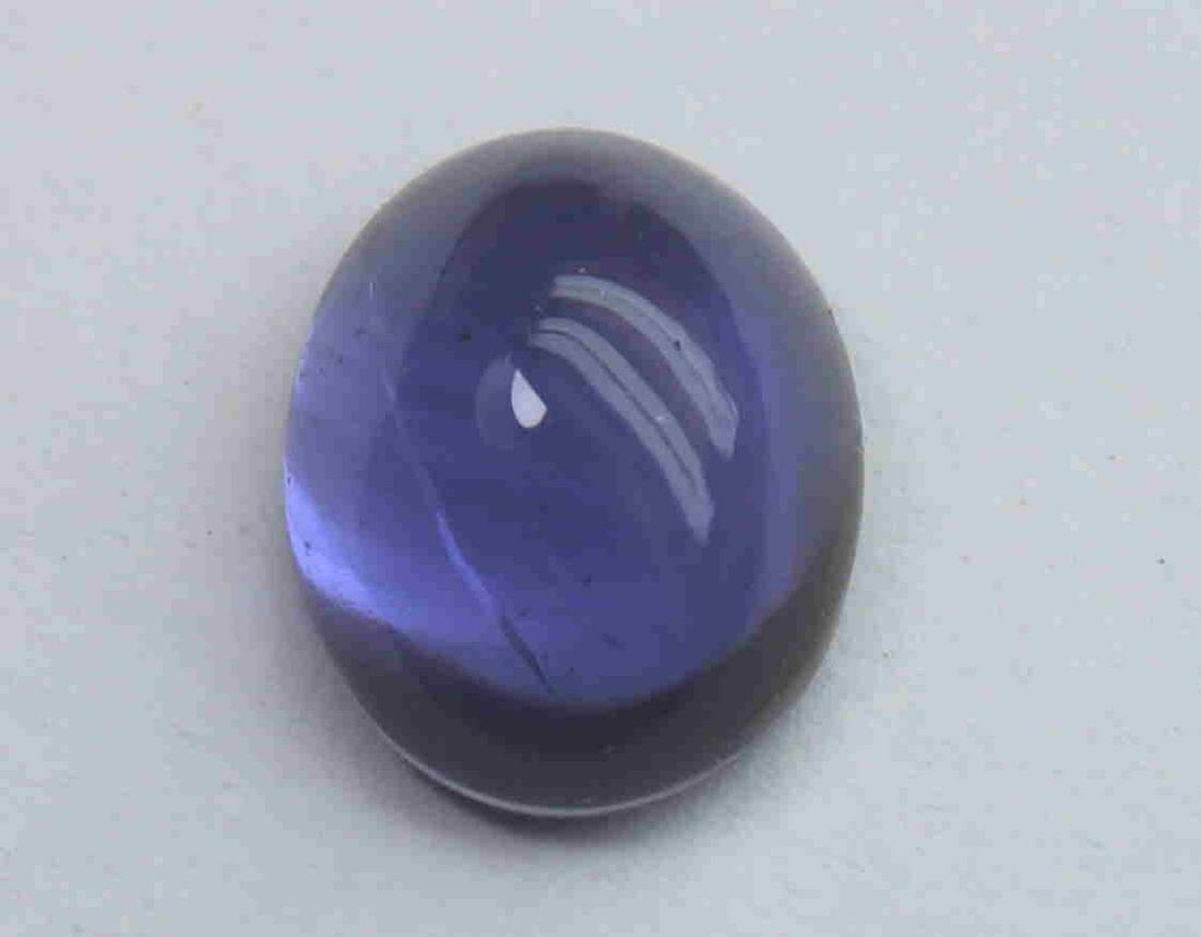 1.44 Cts Natural Iolite: No Reserve! Title: 1.44 Cts Natural Iolite Additional Information: Gemstone: Natural Iolite Origin: India Weight: 1.44 Carats Measurements: 8.6x6.5x3.8 mm Shape / Cut: Oval Cabochon Colour: Violet Blu