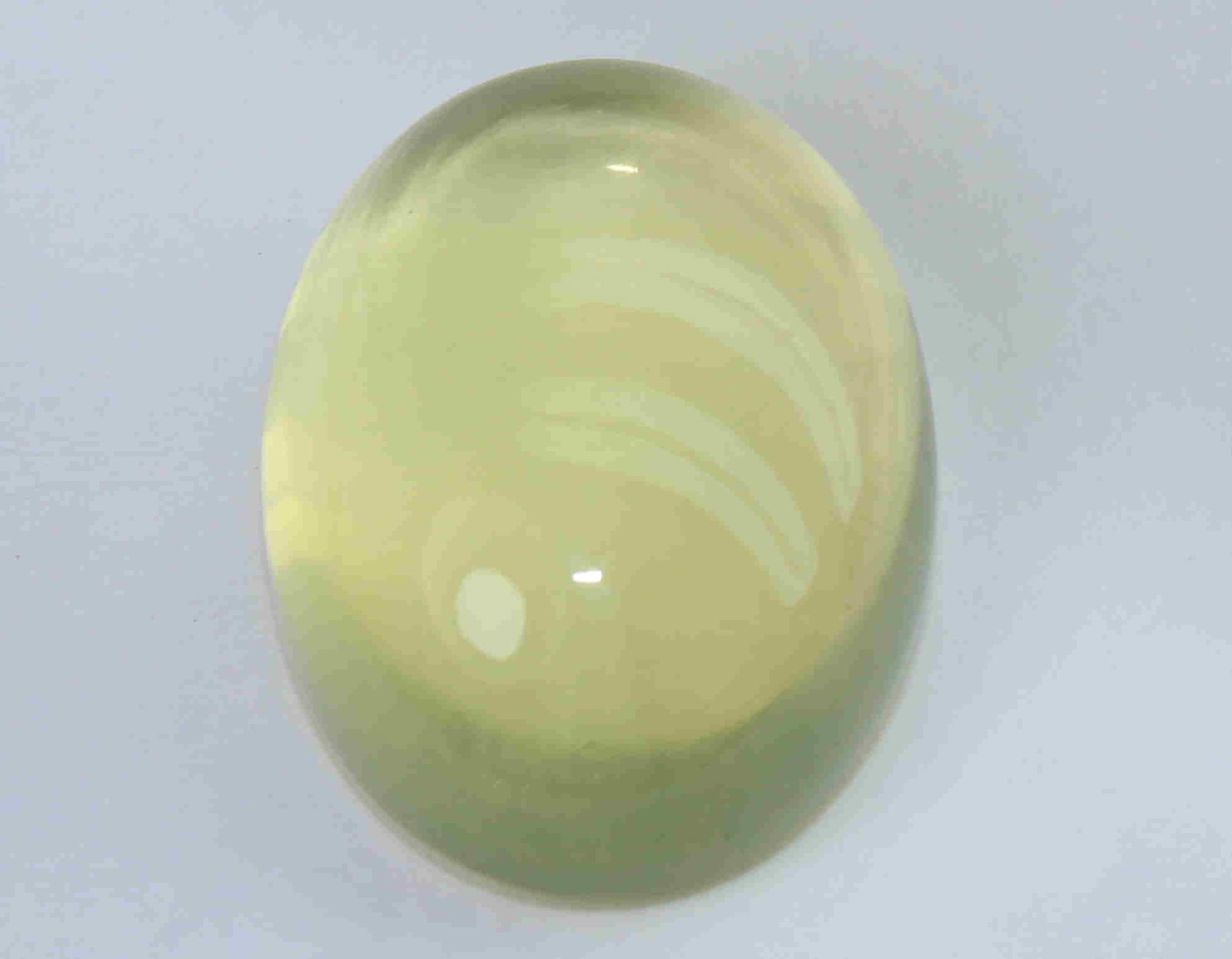 34.07 Cts Natural Lemon Quartz: No Reserve! Title: 34.07 Cts Natural Lemon Quartz Additional Information: Gemstone : Natural Lemon Quartz Weight : 34.07 Carats Dimensions : 23x17.5x10.6 mm Shape : Oval Cabochon Colour : Greenish Yel