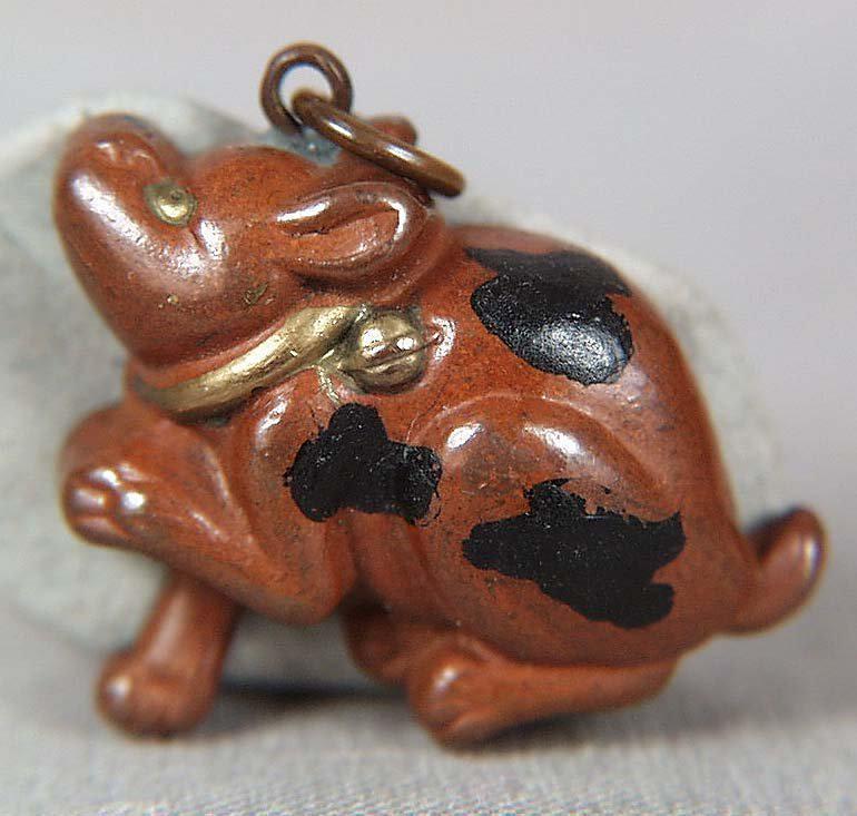 19c Japanese mixed metal pendant PUPPY / COMPASS: Title: 19c Japanese mixed metal pendant PUPPY / COMPASS Description: Unusual 19th century Japanese mixed metal pendant, its front made as a seated piebald puppy wearing a gilded collar, its front paw 