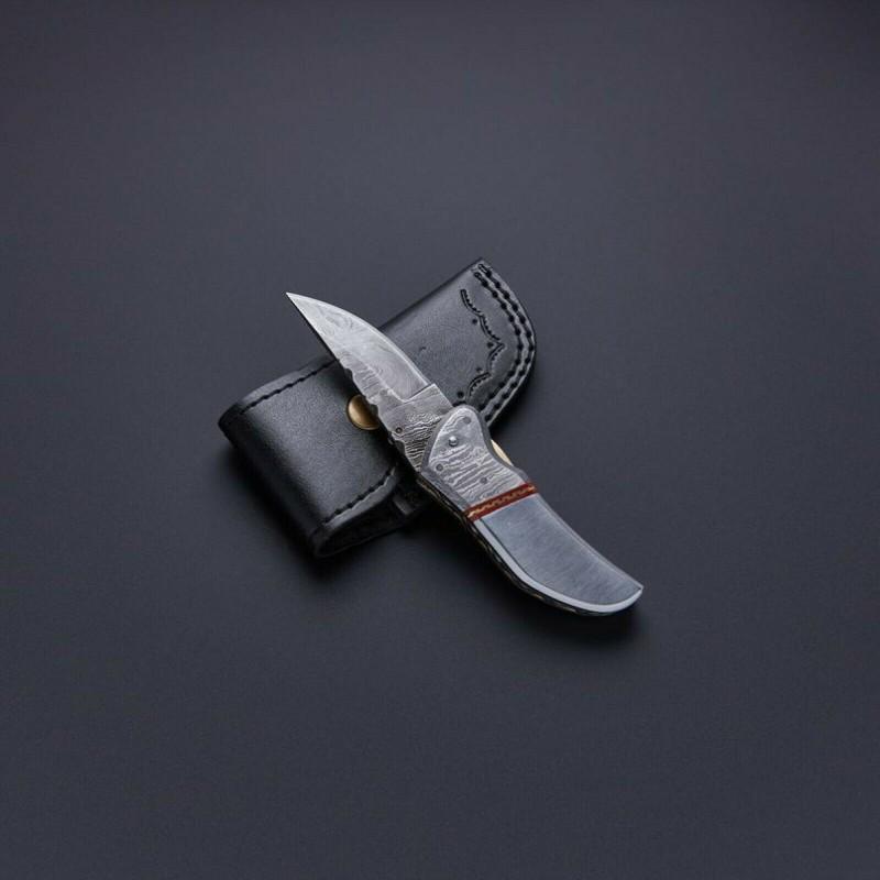 Handmade folding pocket hiking damascus steel knife: Knife "Earth" Blade - damask steel Handle – micarta, damascus steel bolster Blade hardness – 56-58 HRC Total length – 170 mm. Blade length - 76 mm. Handle length – 94 mm. Blade Butt Thickness 