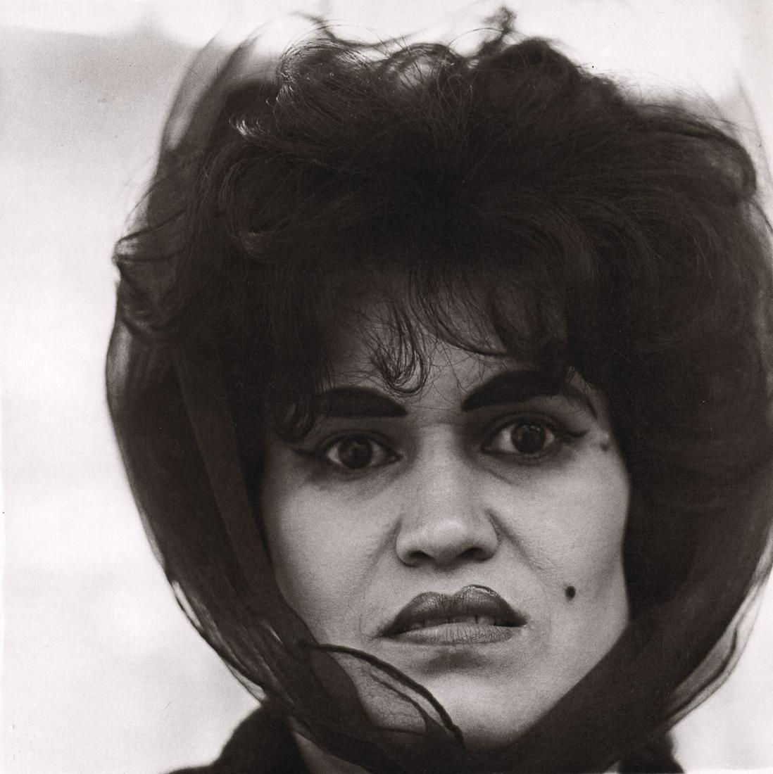 DIANE ARBUS - Puerto Rican Woman with a beauty mark,: Artist: DIANE ARBUS Print Title: Puerto Rican Woman with a beauty mark, NYC, 1965 Medium: Photoengraving Printed 1970’s in the US Image size (inches) approx. 8 x 8” Diane Arbus (1923 –1971),was 