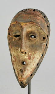 LEGA Powerful Bwami cult Lukwakongo wooden Mask Congo: CONGO DRC Powerful LEGA Bwami Lukwakongo MASK Small mask, very special With his engraved beard and headdress and traces of polychrome, three rare elements in the masks of this tribe This type of