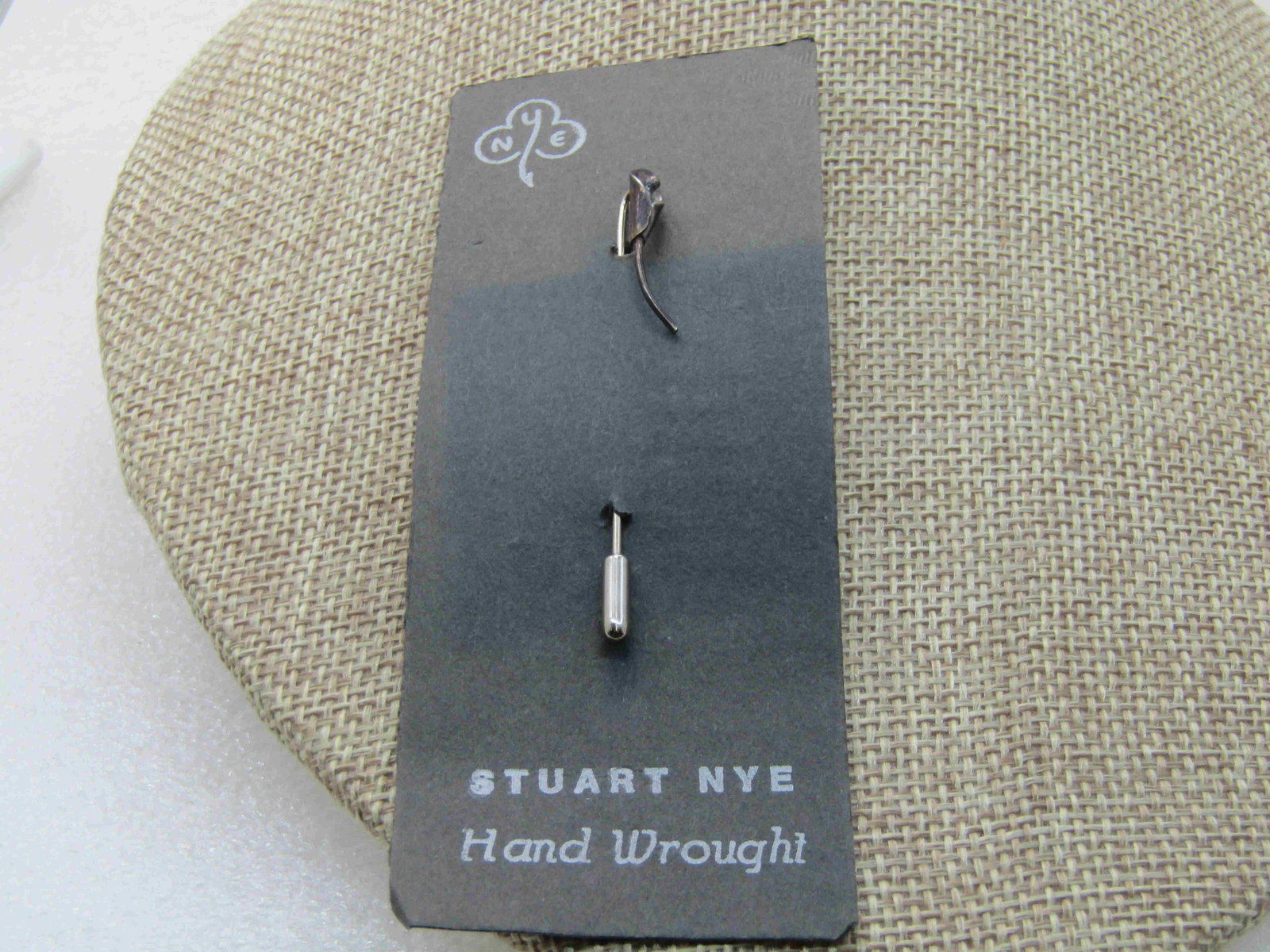 Vintage Sterling Stuart Nye Cala Lilly Stick Pin: Vintage Sterling Stuart Nye Cala Lily Stick Pin, 2.25 with safety cap. Oriignal Card. Staurt Nye Hand Wrought Sterling. Southern Highland Handicraft Guild Member. Piece is also signed and marked sterl