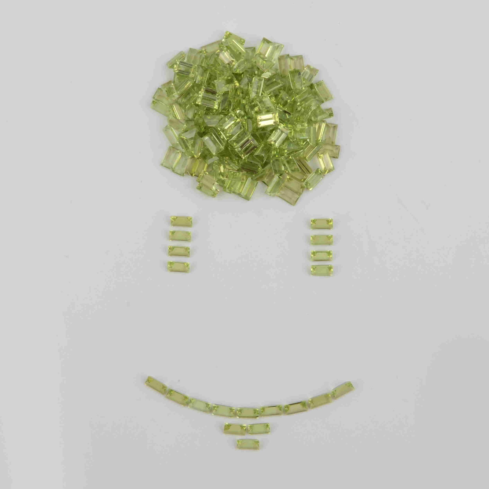 64.38 Carat Green Color Natural Baguette Peridot Loose: Title: 64.38 Carat Green Color Natural Baguette Peridot Loose Gemstone 196 Pieces Brand: Gems Trading Center Gemstones: Peridot Carat Weights: 64.38 Size/Dimensions: 2H x 3W x 5L mm Reserve: $90.00 Sh