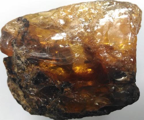 16.86 GRAM 100 MILL YEARS OLD ROUGH BURMITE AMBER: Title: 16.86 GRAM 100 MILL YEARS OLD ROUGH BURMITE AMBER Origin: Hukawang Valley, Kachin State, Myanmar Size: 4x3x2 cm / 16.86 gram Description: yellow/orange burmite amber with crust of black matrix 
