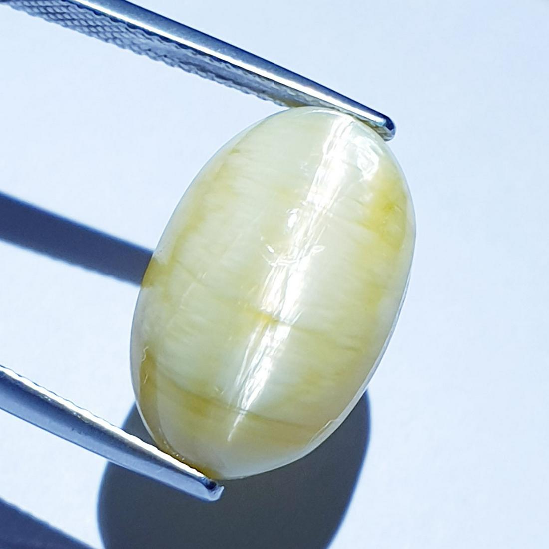 16.67 ct Natural Opal Cat's Eye: Title: 16.67 ct Natural Opal Cat's Eye Color/Clarity: Semi Transparent Gemstones: Loosegemstone Carat Weights: 16.67 Size/Dimensions: 18.00 x 11.50 x 13.40 Additional Information: Oval - Africa Shippi