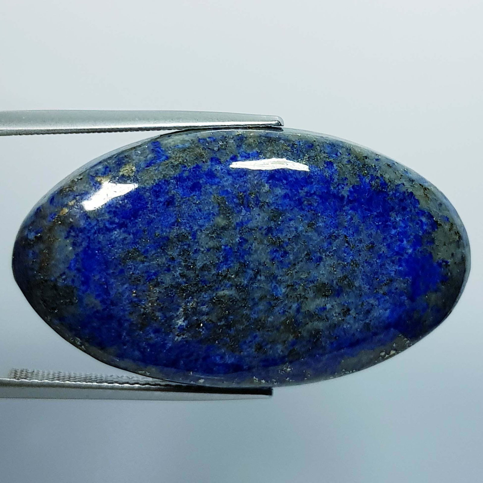 51.35 ct Natural Lapis Lazuil: Title: 51.35 ct Natural Lapis Lazuil Color/Clarity: Opaque Gemstones: LooseGemstone Carat Weights: 51.35 Size/Dimensions: 38.20 x 21.65 x 6.25 Additional Information: Oval - Afghanistan/Chile Shipping